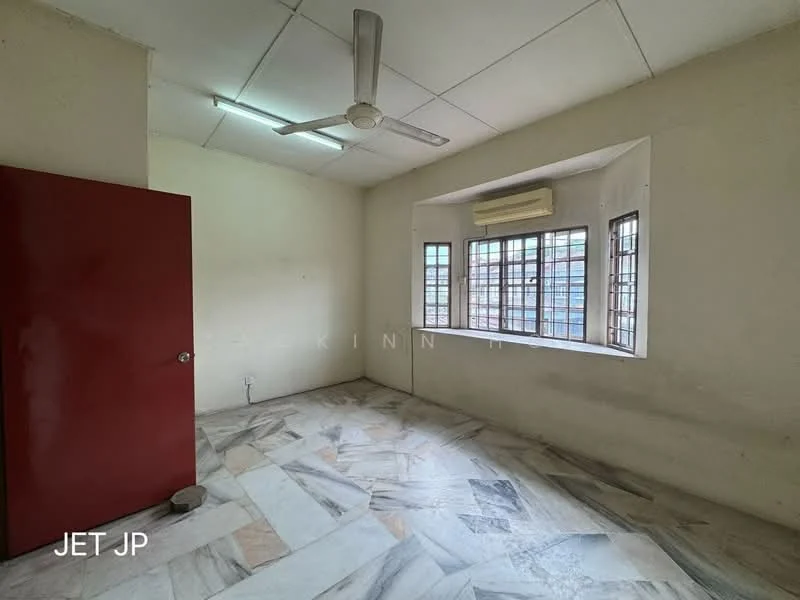 Room features: white painted walls, marble tile flooring, ceiling fan, window with grid pattern, red wooden door, air conditioning unit.