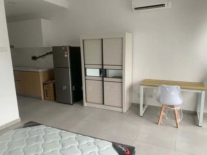 Room features: grey tiled flooring, white painted walls, built-in wardrobe with sliding doors, stainless-steel fridge, kitchen countertop with wooden cabinetry, white desk with wooden legs, plastic chair, wall-mounted air conditioning unit, mattress on the floor; style: modern.