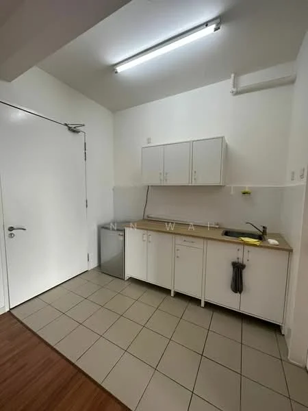 Kitchen features: white cabinetry, laminate countertop, single-bowl stainless-steel sink, chrome pull-down faucet, built-in fridge, tile flooring, fluorescent ceiling lights, wall-mounted cabinets, kitchen towel hanging, neutral wall color; style: modern.