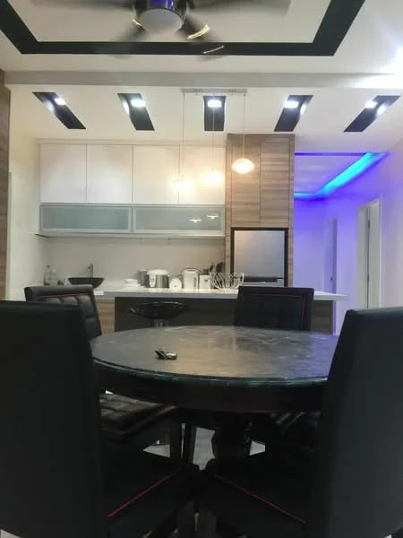 Dining features: round dining table, black leather dining chairs, ceiling fan with light, recessed LED downlights, pendant light, white cabinetry, wood paneling, kitchen island, stainless-steel appliances, grey marble countertop, open layout, accent lighting, wall with blue LED strip lighting; style: modern.