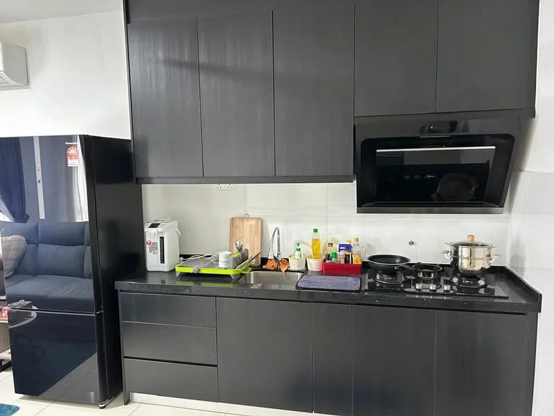 Kitchen features: black cabinetry, black granite countertop, stainless-steel gas hob, stainless-steel pot, stainless-steel kettle, white electric rice cooker, black refrigerator, built-in oven, white wall tiles, grey floor tiles, black sink, kitchen utensils, wooden cutting board, various bottles of condiments; style: modern.