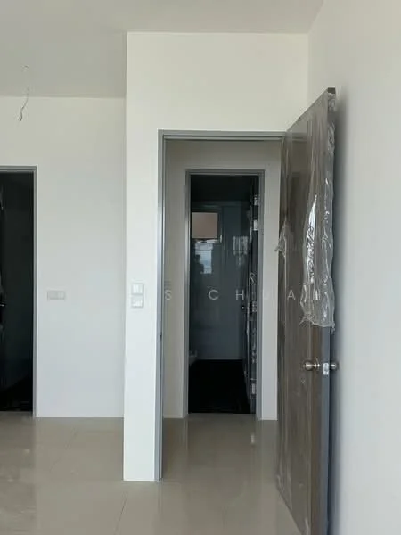 Room features: white painted walls, tile flooring, door with plastic wrap, door frame, light switch, door handle, visible door to bathroom, open doorway.