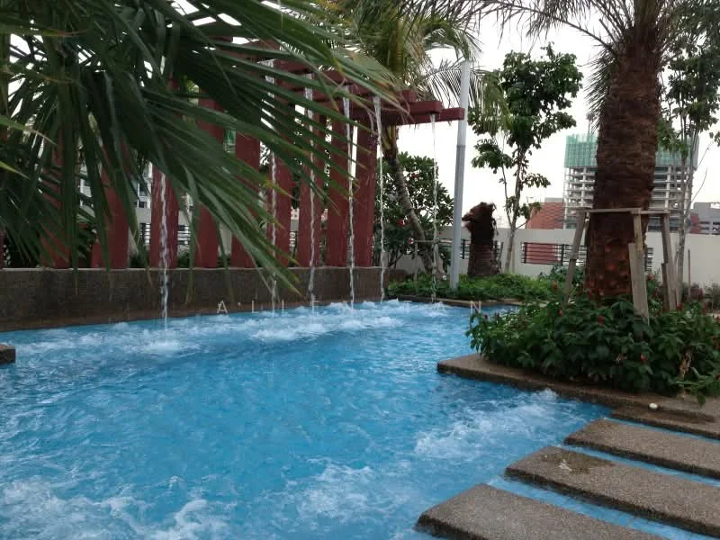 Exterior type: swimming pool deck; features: infinity pool with water features, palm trees, landscaped garden, stone-paved walkway, waterfall feature, surrounding greenery, pool deck with loungers; style: modern.