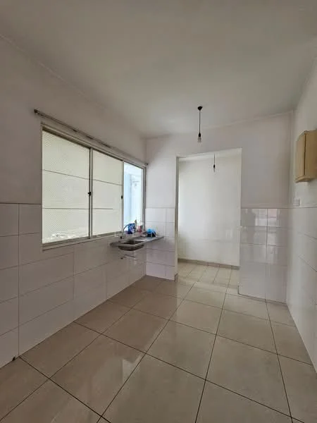 Kitchen features: white tiled walls, cream tiled flooring, single-bowl stainless-steel sink, window with mesh screen, light fixture, open layout, counter space, doorway to adjacent room.