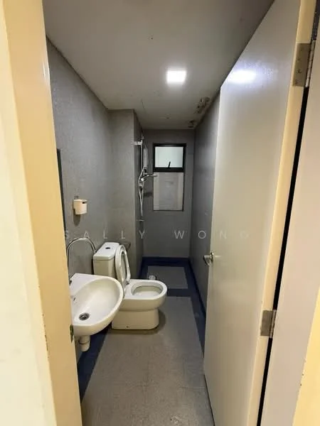 Bathroom features: grey tiled walls, light grey floor tiles, shower with wall-mounted faucet, toilet, sink with pedestal, window for natural light, ceiling light fixture.