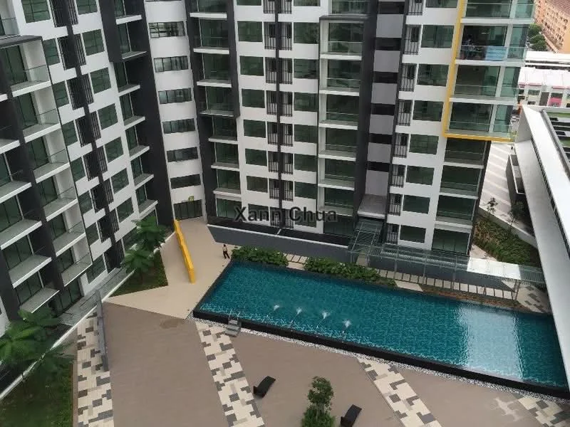 Exterior type: high-rise condominium; features: swimming pool, pool deck with loungers, landscaped garden area, modern facade with glass and concrete, balconies on multiple floors, yellow accent feature wall, paved walkway, surrounded by greenery; style: modern.