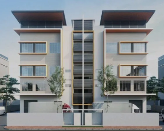 Exterior type: low-rise apartment block; features: white painted facade, glass curtain wall, horizontal louvre screens, recessed balconies, wooden overhangs, two-storey building, manicured landscaping, trees in front, parking area visible, modern architectural design; style: modern.