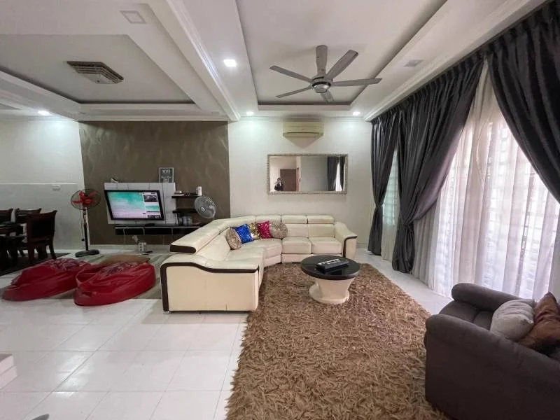 Living features: L-shape sectional sofa in cream and brown, coffee table, area rug with beige and brown tones, wall-mounted TV, TV console, 5-blade ceiling fan with light, recessed downlights, large windows with sheer curtains, decorative mirror, wall-mounted air conditioning unit, decorative cushions in various colors, two red bean bags, dining area visible in background with wooden dining table and chairs; style: modern.