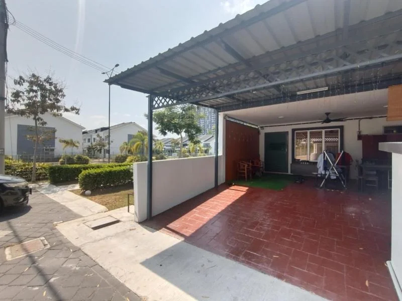 Exterior type: linked terrace house; features: covered car porch with awning, red brick flooring, manicured lawn, tropical landscaping, paved walkway, surrounded by greenery, single-storey structure, exterior wall with white paint, metal roof, ceiling fan visible in porch area; style: modern.