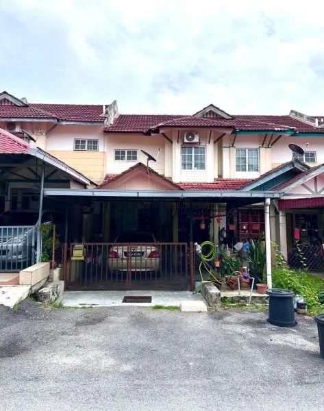 Exterior type: linked terrace house; features: two-storey building, red tiled roof, cream painted facade, car porch with awning, driveway with interlocking pavers, front garden area, visible air conditioning unit, parking space for one car, mature greenery around, gated entry; style: modern.