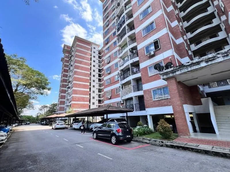 Exterior type: mid-rise condominium; features: red brick facade, balconies with metal railings, covered parking area, landscaped garden, manicured lawn, multiple storeys, surrounded by trees, driveway with marked parking spaces; style: modern.