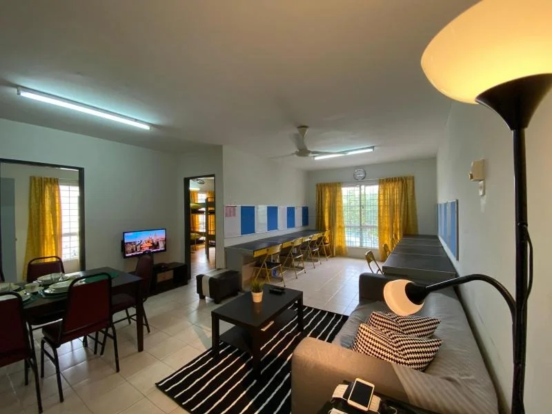 Living features: grey fabric sofa, black and white striped area rug, coffee table, floor lamp, wall-mounted TV, dining table with chairs, yellow curtains, ceiling fan, wall clock, tile flooring, light grey painted walls; style: modern.