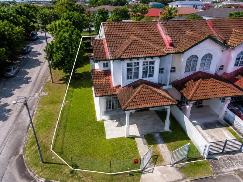 Exterior type: semi-detached house; features: double-storey, white painted facade, red clay tile roof, projecting rooflines, arched windows, white-framed windows, covered car porch, double car porch, driveway with concrete paving, front lawn, corner lot, perimeter fence, gated entry, fronts a quiet residential street, surrounded by mature greenery; style: traditional.