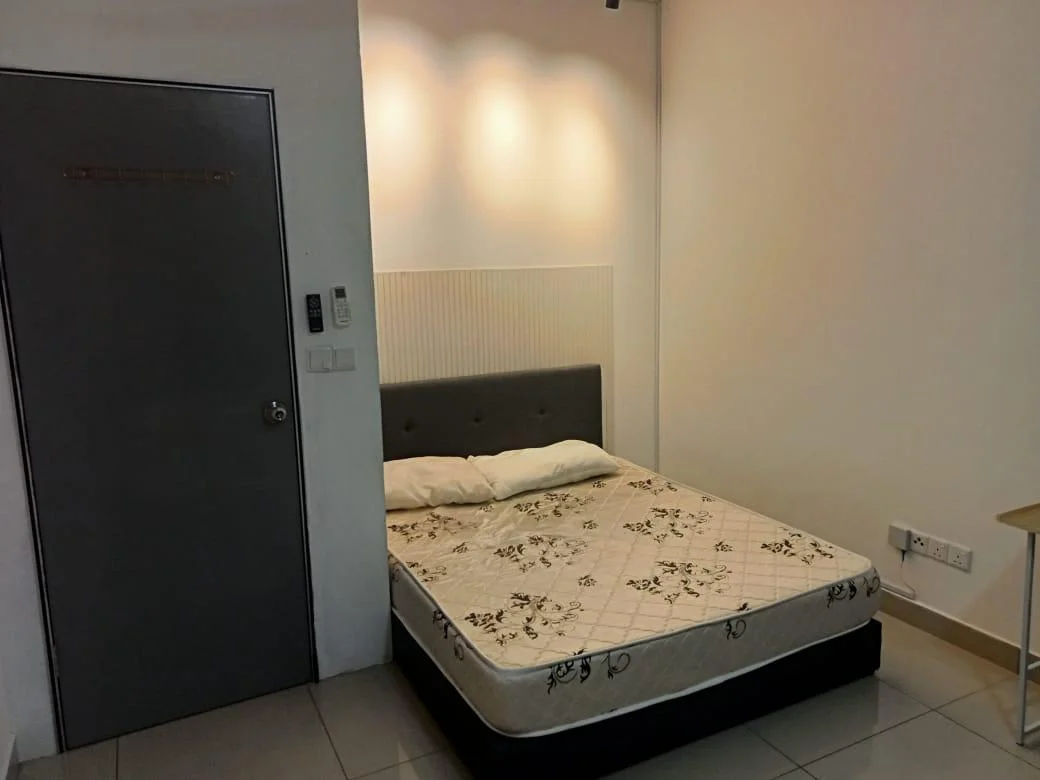 Bedroom features: queen-size bed, upholstered headboard, white painted walls, grey door, wall-mounted intercom, tile flooring, bedside table, light fixture on wall; style: modern.