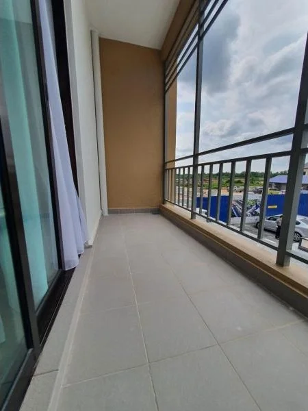 Room features: sliding glass door, floor-to-ceiling windows, grey tiled flooring, balcony railing, white sheer curtains, exterior view, concrete wall, outdoor space; view: city.