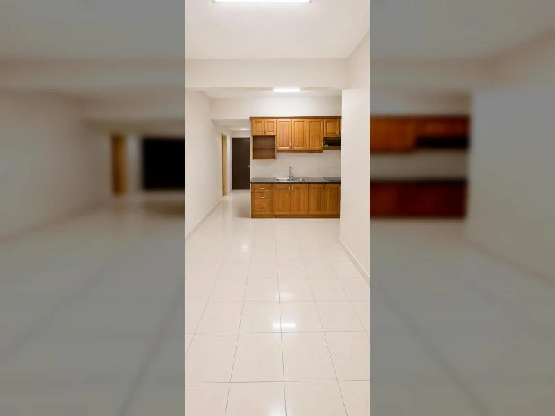 Kitchen features: white painted walls, white glossy tile flooring, flat ceiling, recessed ceiling light, rectangular ceiling light, wooden lower cabinets, wooden upper cabinets, open corner shelving, dark stone countertop, stainless-steel sink, chrome faucet, tiled backsplash, built-in range hood, doorway to adjacent hallway, narrow galley-style layout; style: contemporary.