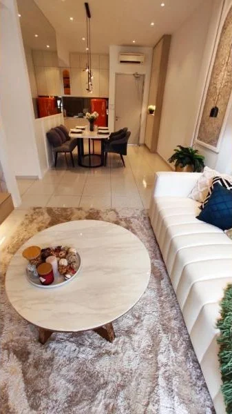 Living features: white leather sofa, marble coffee table, area rug with geometric pattern, recessed downlights, wall-mounted air conditioning unit, decorative wall art, open-plan layout to kitchen and dining, floor-to-ceiling windows, light-colored tiled flooring; style: modern. Kitchen features: red cabinetry, stainless-steel appliances, kitchen island, pendant lighting, open shelving, ceramic tile backsplash; style: modern. Dining features: round dining table, four dining chairs, decorative centerpiece; style: modern.