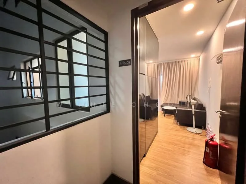 Room features: wooden flooring, white painted walls, recessed downlights, large windows with black metal grills, curtains, door with glass panel, fire extinguisher, seating area with armchairs, side table; style: modern.