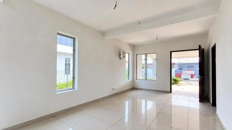 Living features: white painted walls, glossy beige ceramic tile flooring, white ceiling, recessed ceiling beams, bare light bulb wiring points, large rectangular windows, sliding glass door, open doorway to exterior, dark wood door frame, white electrical outlet, wall-mounted split air conditioner, natural daylight, unfurnished room; style: modern; view: garden.