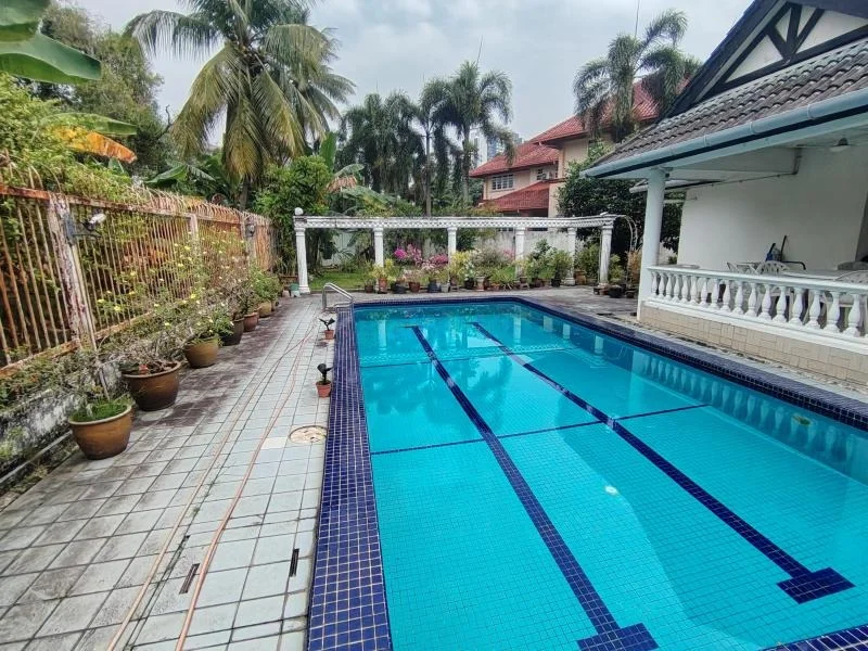Exterior type: detached bungalow; features: swimming pool with lap lanes, pool deck with tiles, tropical landscaping with palm trees, manicured garden with potted plants, covered outdoor seating area, fence surrounding the property, brick pathway, outdoor pergola; style: tropical-modern.