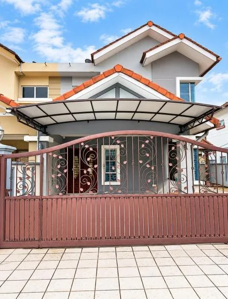 Exterior type: linked terrace house; features: double-storey, white painted facade, light grey facade, projecting gabled roof, pitched tile roof, orange roof tiles, covered car porch with awning, metal gate, decorative wrought-iron gate, front boundary fence, tiled driveway, fronts a quiet residential street; style: contemporary.