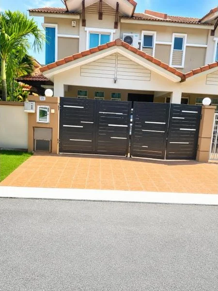 Exterior type: semi-detached house; features: double-storey, cream painted facade, white trim, pitched tile roof, terracotta roof tiles, projecting roof gables, fronts a quiet residential street, car porch with awning, driveway with terracotta tiles, black metal swing gate, perimeter wall, mature palm tree, small front lawn; style: contemporary.