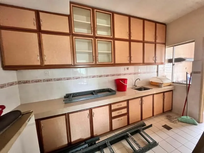Kitchen features: light wood cabinetry with glass-front upper cabinets, laminate countertop, single-bowl stainless-steel sink, chrome pull-down faucet, tile backsplash, ceramic tile flooring, window above sink, kitchen appliances visible, red bucket, cleaning tools, open shelving, built-in cabinets.