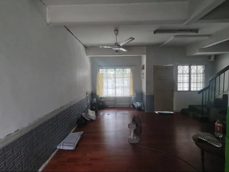 Living features: white painted walls, wooden flooring, 5-blade ceiling fan, floor-to-ceiling windows, curtains, wooden staircase, decorative wall paneling, natural light from windows, fan on the floor.