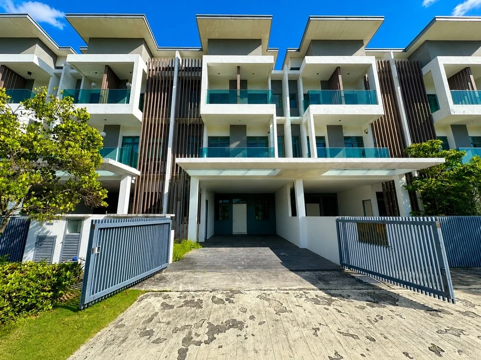Exterior type: townhouse; features: double-storey, white painted facade, flat roof, projecting balconies, glass balcony railings, vertical timber slat screens, covered car porch, driveway with concrete paving, gated entry, manicured lawn, tropical landscaping, surrounded by mature greenery; style: modern.