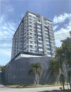 Exterior type: mid-rise condominium; features: grey concrete facade, glass curtain wall, recessed balconies, approximately 10-storey high-rise, manicured landscaping, palm trees in foreground, surrounded by greenery, street view with power lines; style: modern.