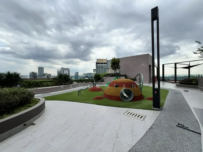 Exterior type: landscape garden; features: playground area with slide, artificial grass lawn, landscaped garden beds, concrete pathway, city skyline view, modern seating area, decorative landscaping, safety railing, outdoor lighting, greenery with shrubs; style: modern.
