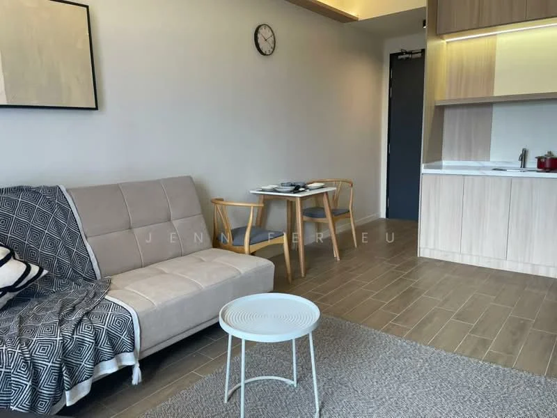 Living features: beige fabric sofa, area rug with geometric pattern, round white coffee table, wooden dining table with two chairs, wall clock, light wood cabinetry, white countertop, grey tiled flooring, neutral painted walls; style: modern.
