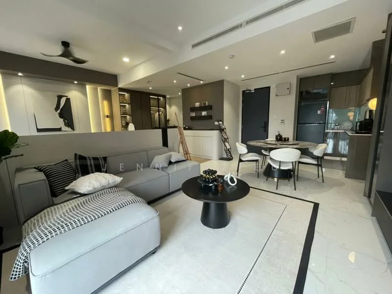Living features: grey fabric sectional sofa, black coffee table, white area rug with geometric pattern, wall-mounted TV, recessed LED downlights, 5-blade ceiling fan, decorative wall art, black dining chairs, round dining table, open kitchen layout, white cabinetry, stainless-steel refrigerator, black countertop, marble tile flooring; style: modern.